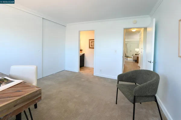 a living room with furniture and a chair