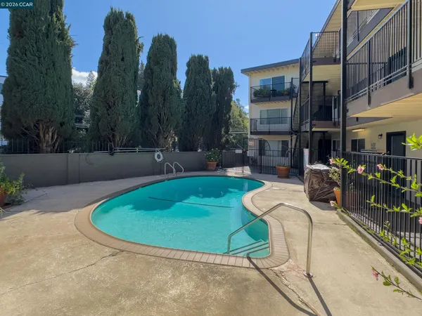 a view of a swimming pool with a patio