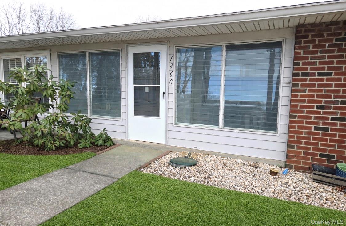 a view of a house with a garden