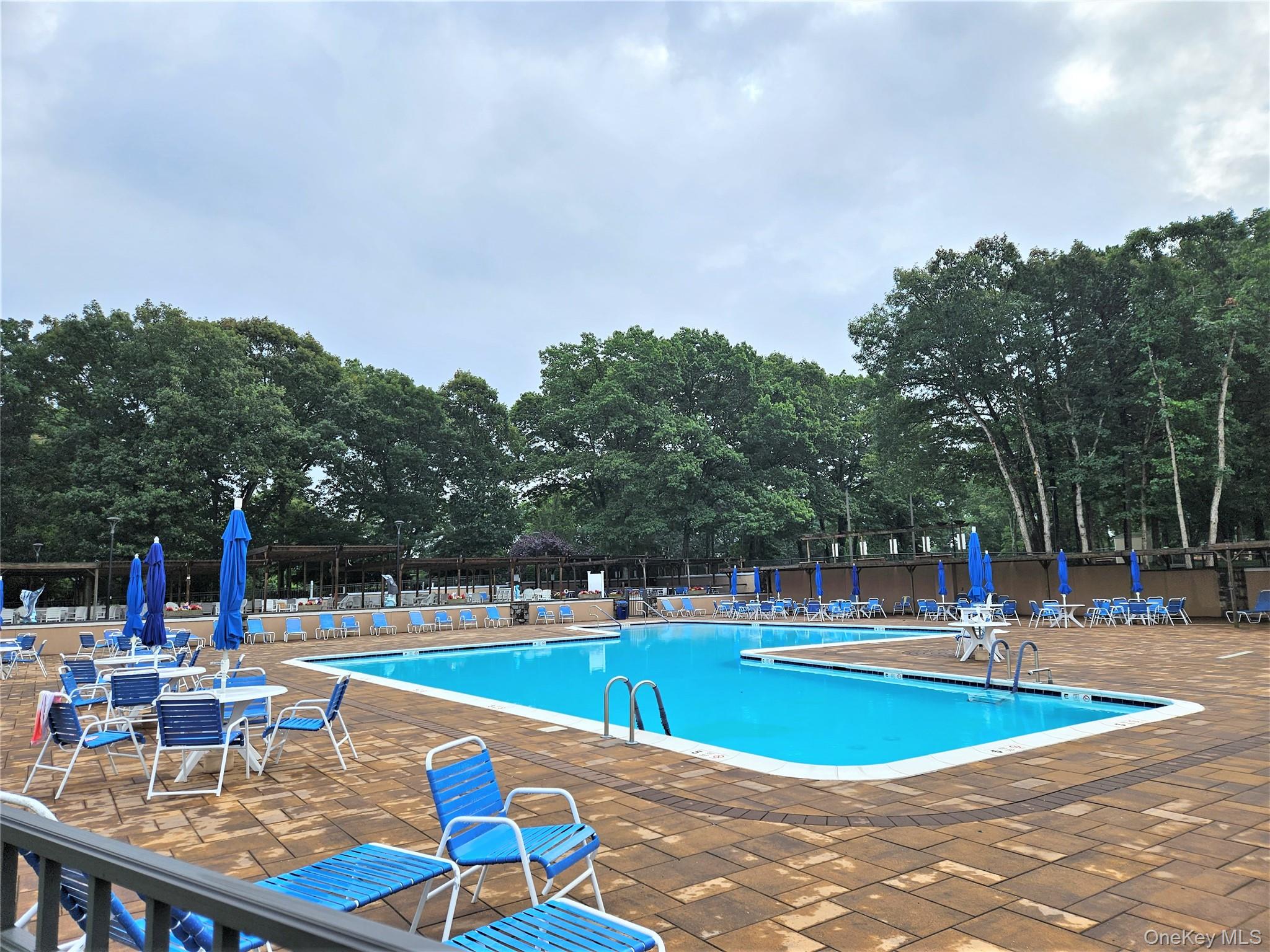 186 C Ventry Court Ridge, NY 11961 - Photo 22 of 25 Enjoy A Break From The Hot Sun In The Spectacular Leisure Village Heated Community Pool, Sunbathe On The Expansive Paver Patios/Pool Surround, Relax & Enjoy!