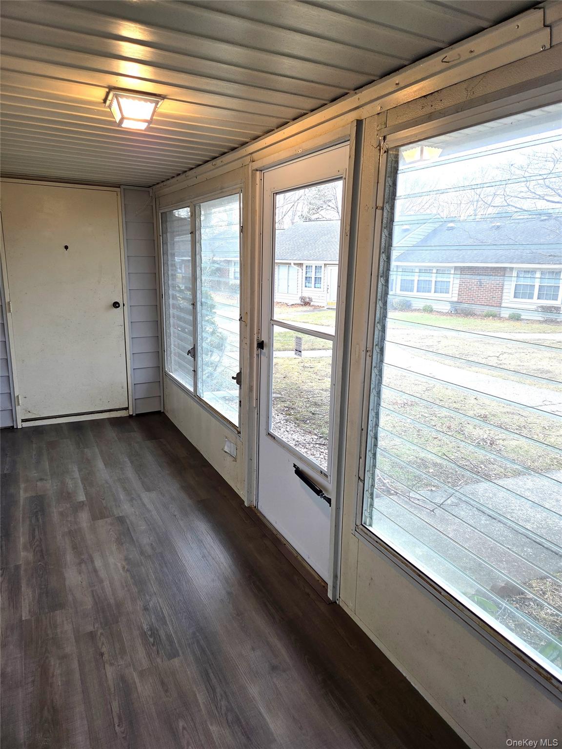 186 C Ventry Court Ridge, NY 11961 - Photo 6 of 25 a view of empty room with wooden floor and fan