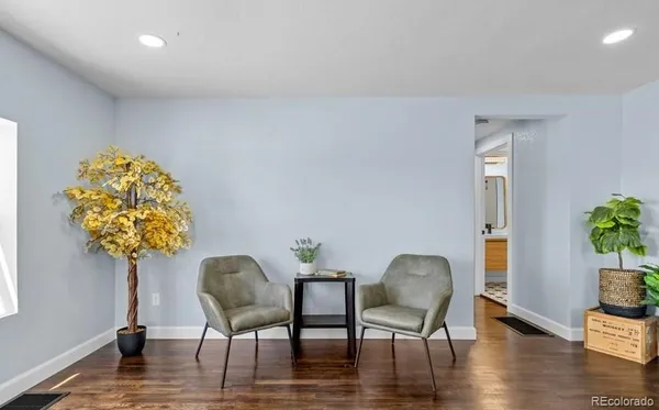 a view of a chairs and table in a room