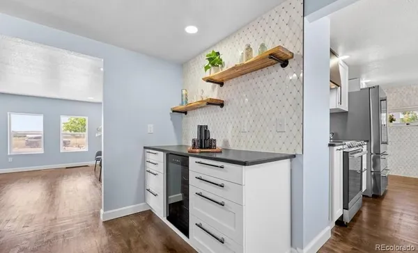a kitchen with a stove and a refrigerator