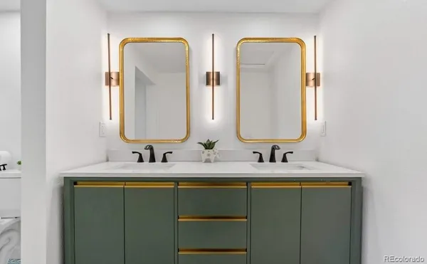 a bathroom with 2 sink and a mirror