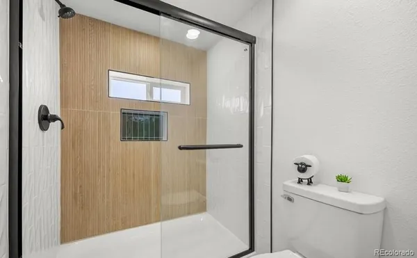a bathroom with a bathtub and shower