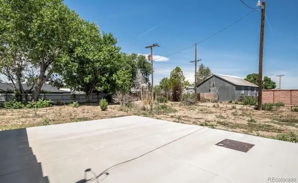 a view of a house with snow on the road