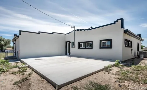 a bedroom with a bed and a mirror