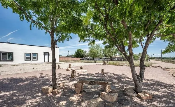 a view of a yard covered in snow
