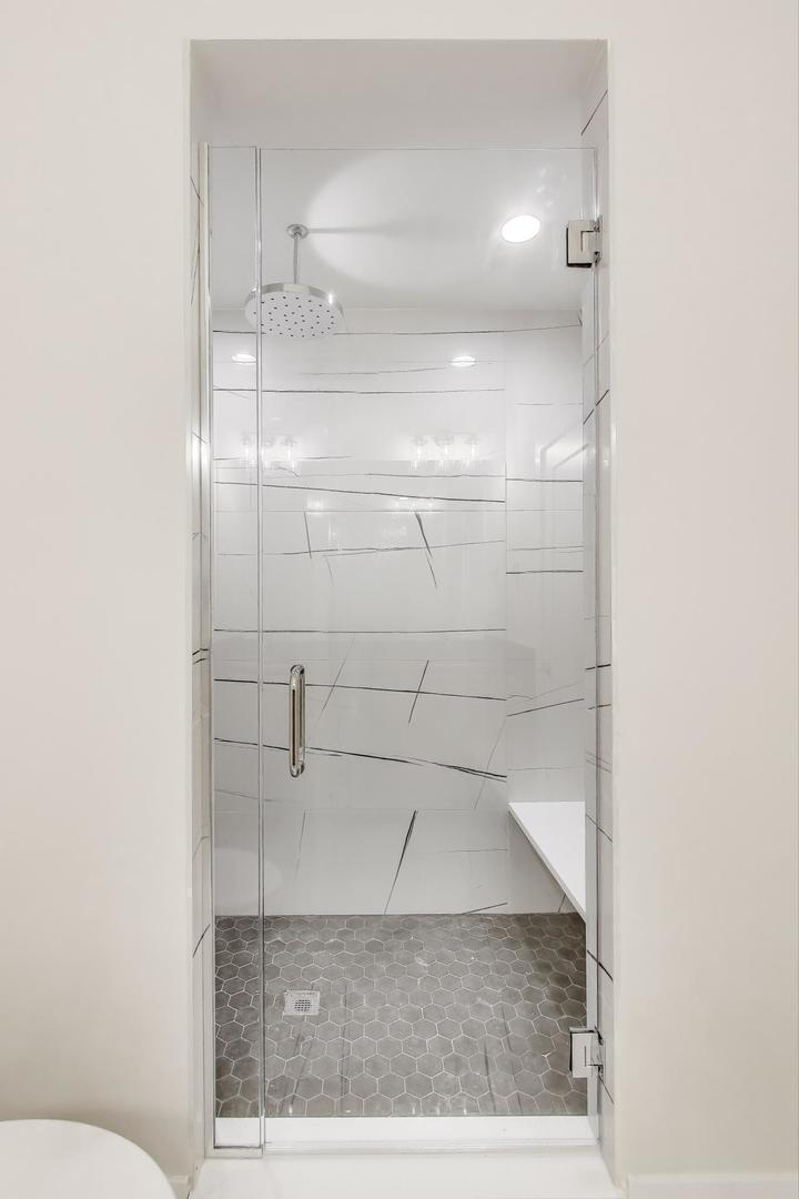 3339 North Ridgeway Avenue, Unit 1S Chicago, IL 60618 - Photo 12 of 20 a bathroom with a shower