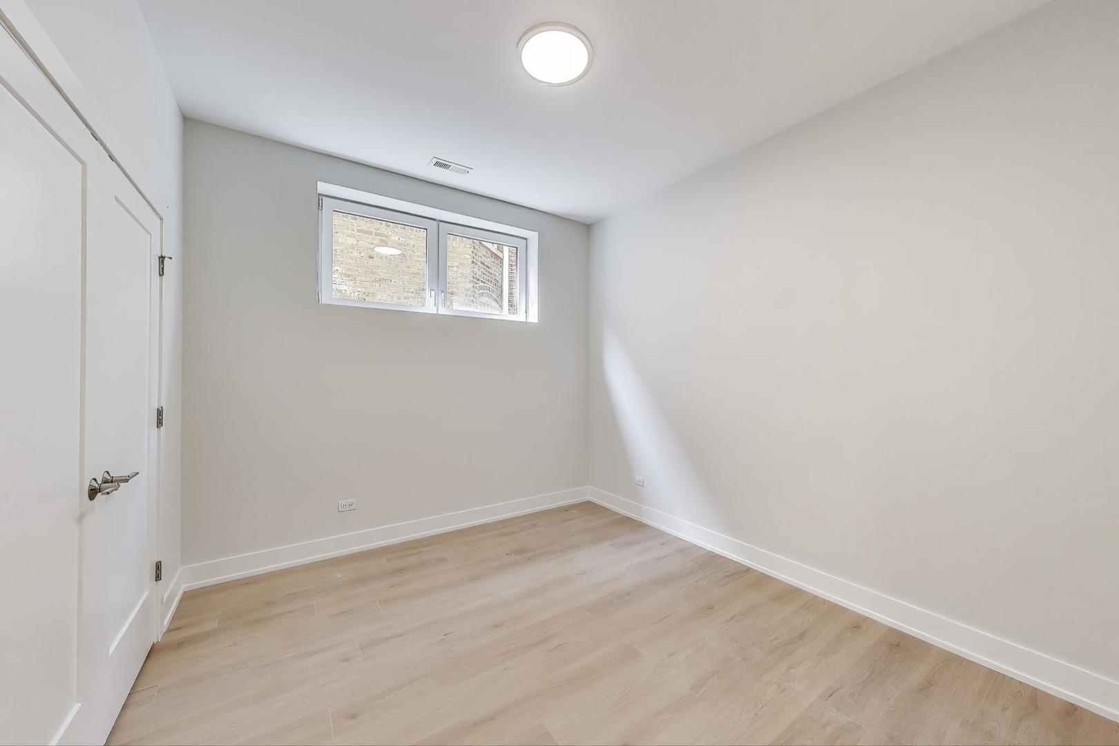 3339 North Ridgeway Avenue, Unit 1S Chicago, IL 60618 - Photo 13 of 20 wooden floor in an empty room