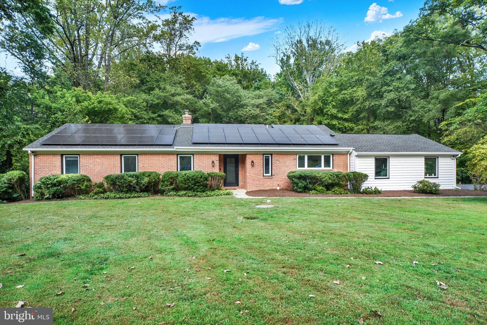 900 Stags Head Road Towson, MD 21286 - Photo 2 of 83 a front view of a house with a garden