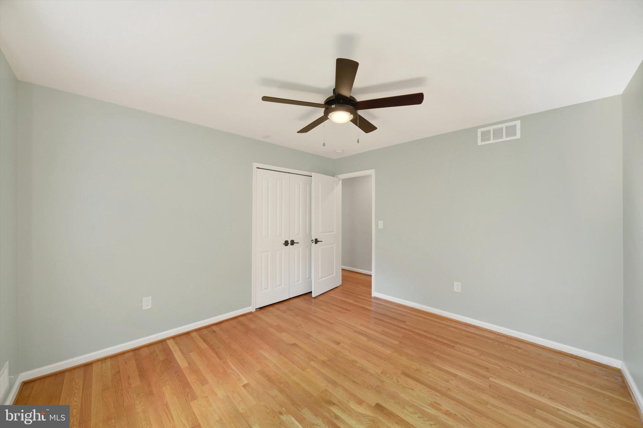 900 Stags Head Road Towson, MD 21286 - Photo 23 of 83 a view of a big room with wooden floor and windows