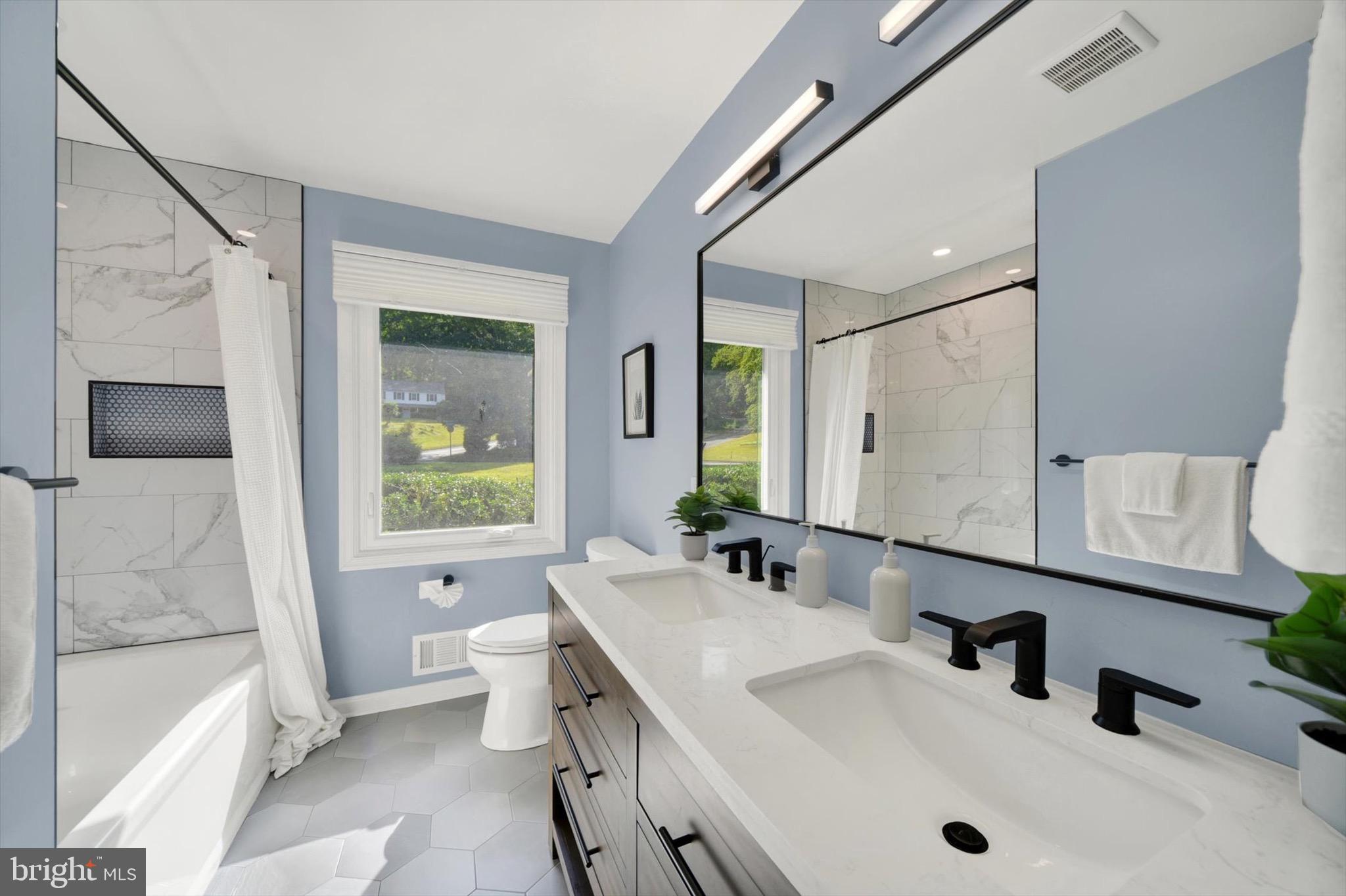 900 Stags Head Road Towson, MD 21286 - Photo 24 of 83 a bathroom with a sink a toilet and tub