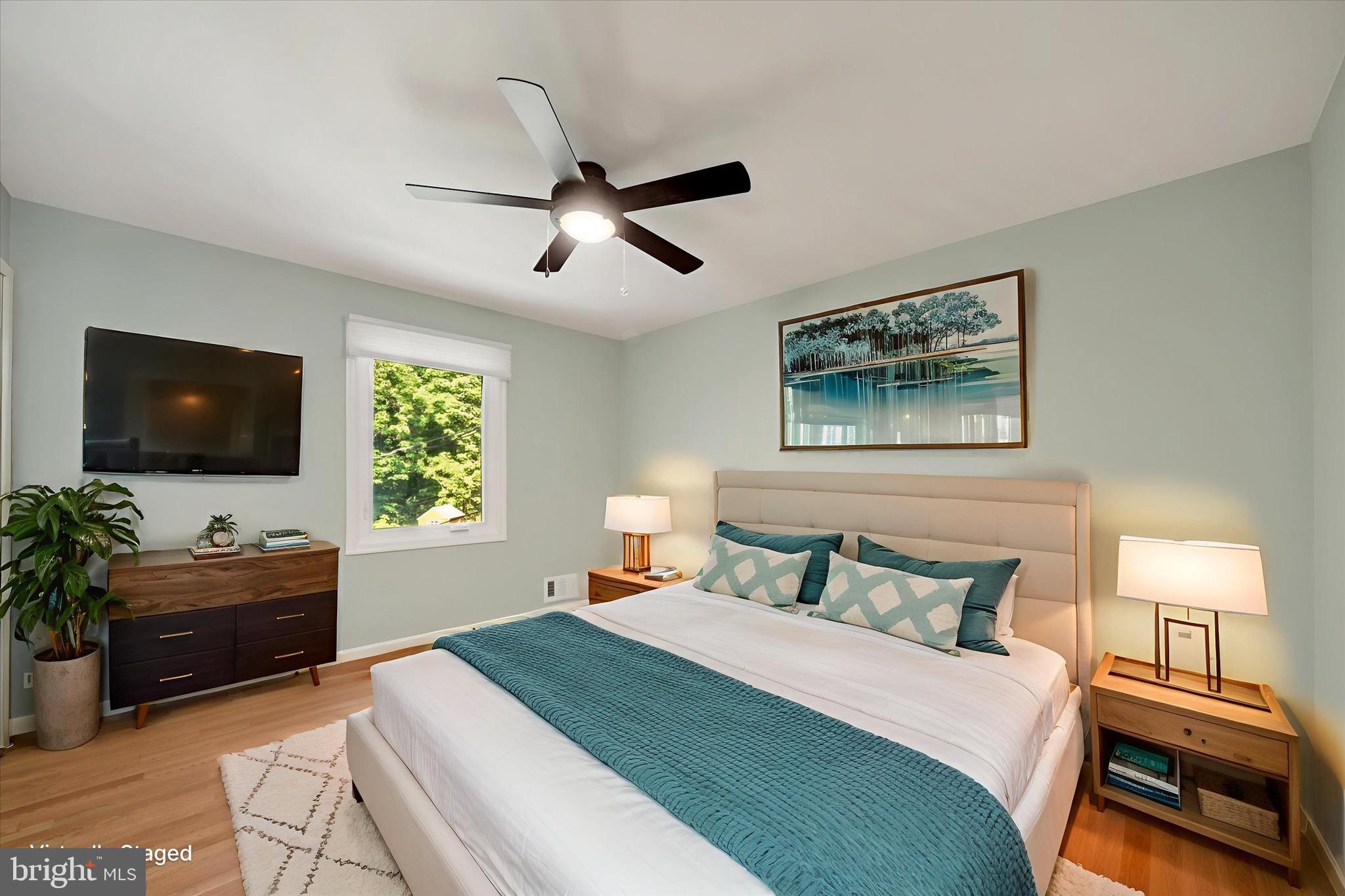 900 Stags Head Road Towson, MD 21286 - Photo 26 of 83 a bedroom with a bed and a flat screen tv