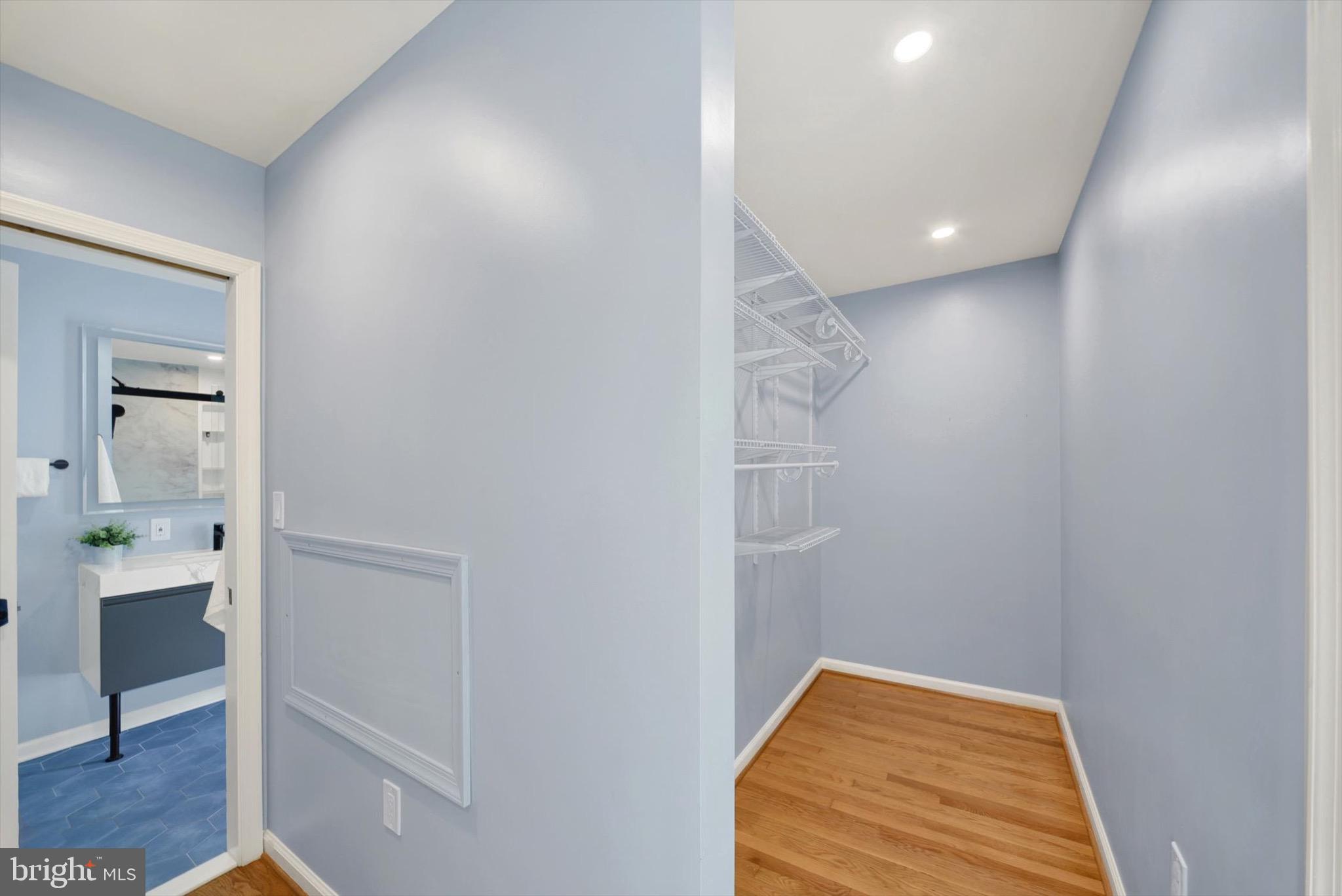 900 Stags Head Road Towson, MD 21286 - Photo 31 of 83 a view of hallway with walk in closet and wooden floor