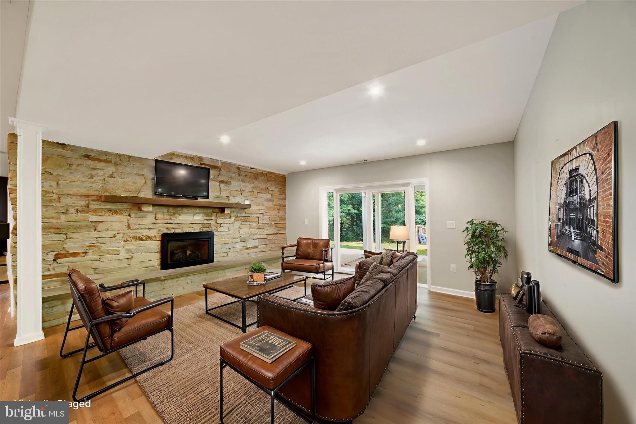 900 Stags Head Road Towson, MD 21286 - Photo 42 of 83 a living room with furniture fireplace and a large window