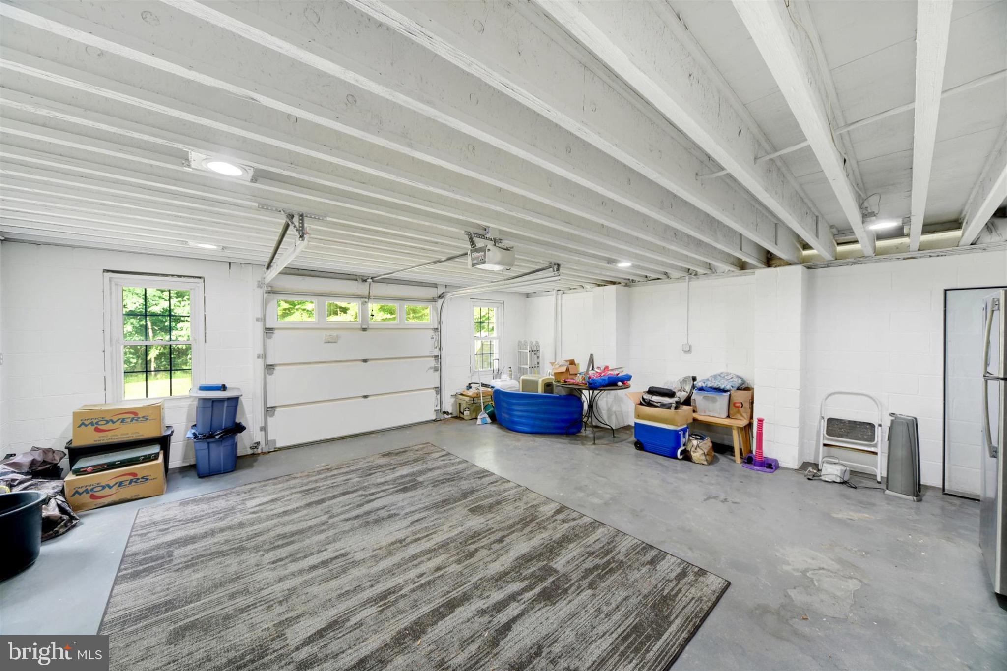 900 Stags Head Road Towson, MD 21286 - Photo 55 of 83 a view of a garage room with furniture and a window