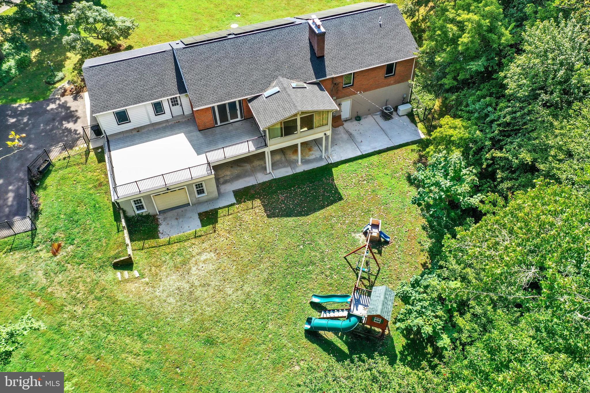 900 Stags Head Road Towson, MD 21286 - Photo 70 of 83 an aerial view of a house with a yard table and chairs