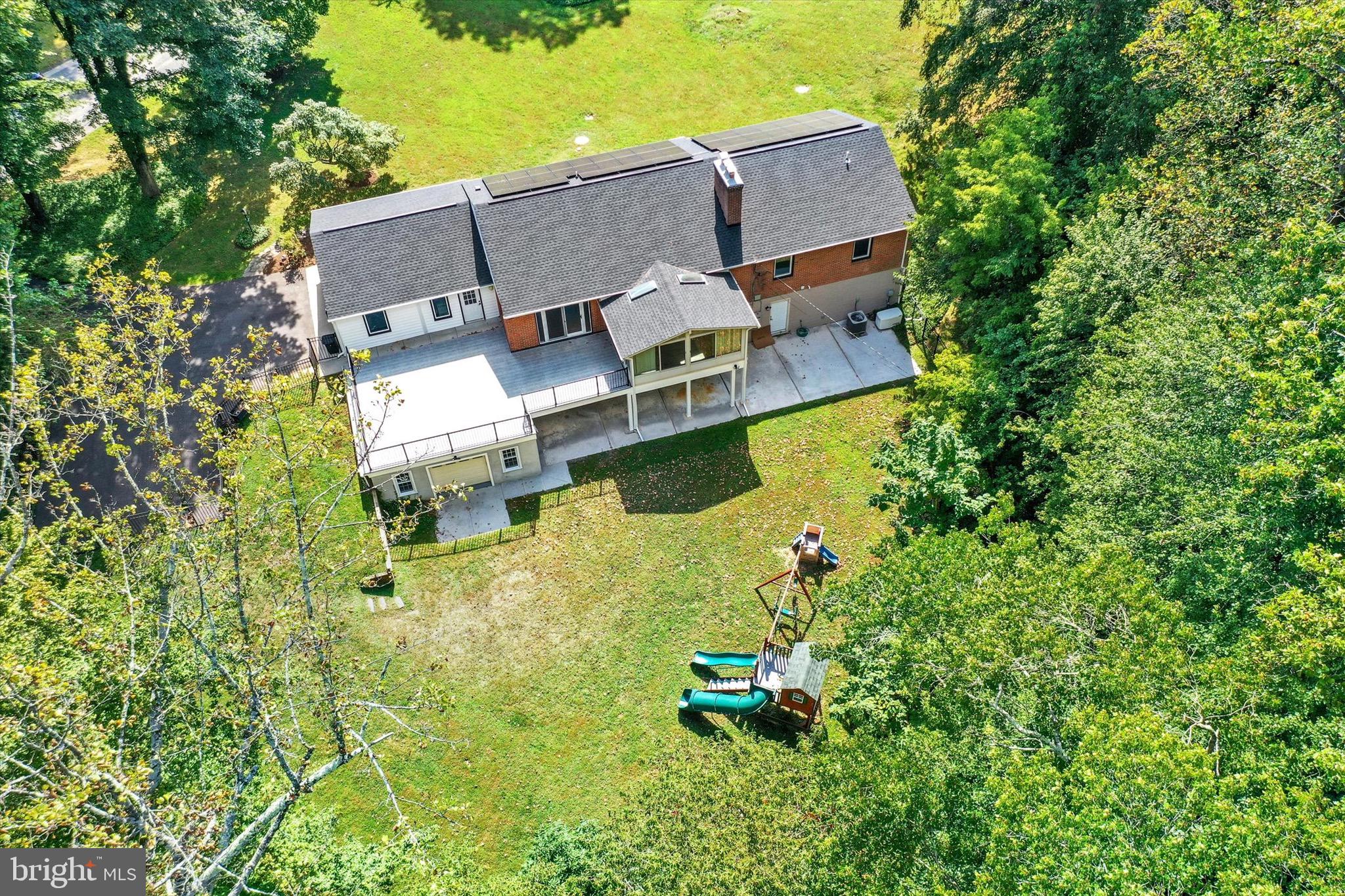 900 Stags Head Road Towson, MD 21286 - Photo 74 of 83 an aerial view of a house with swimming pool outdoor seating and yard