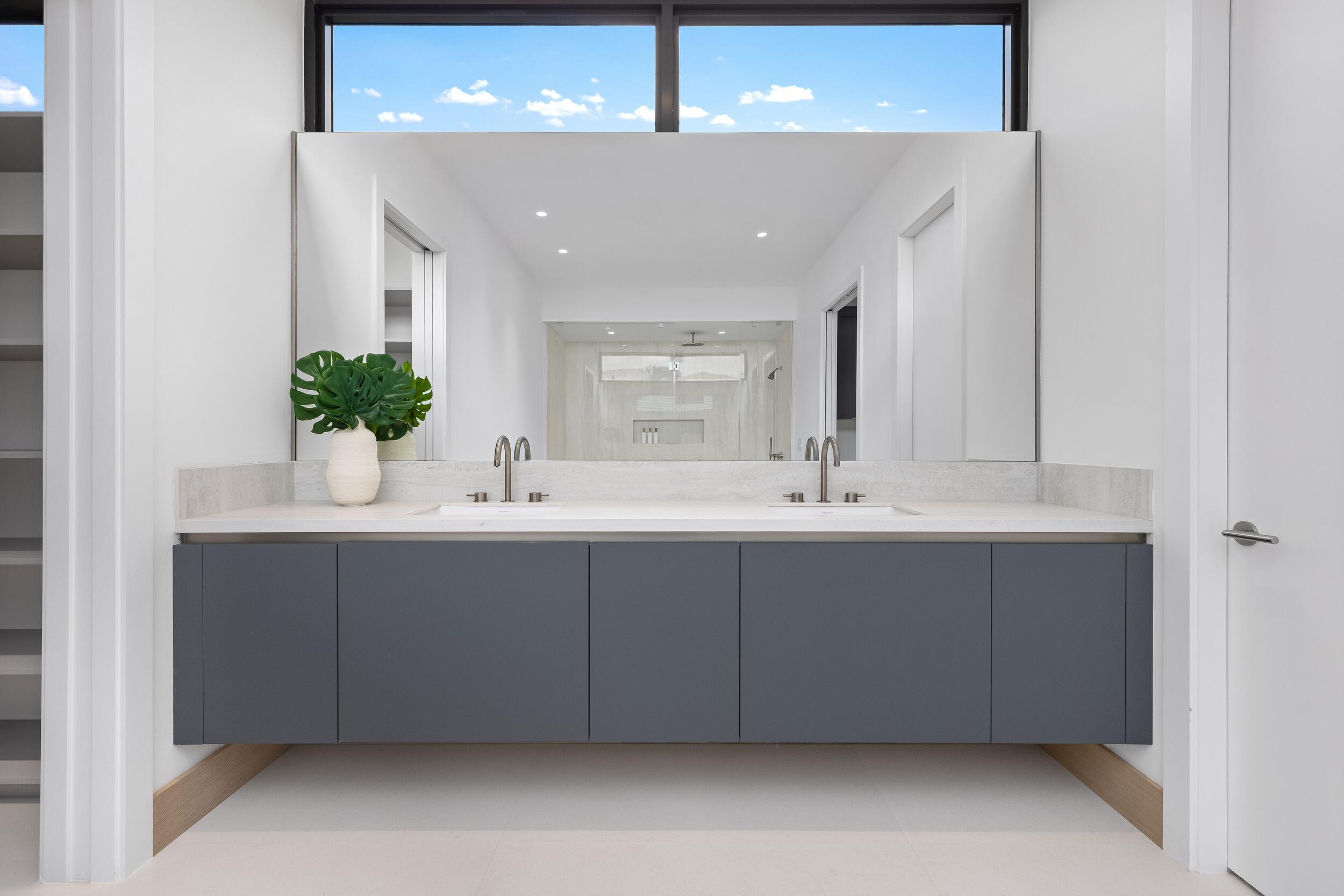 1351 Cocoanut Road Boca Raton, FL 33432 - Photo 85 of 101 a bathroom with a double vanity sink and a mirror