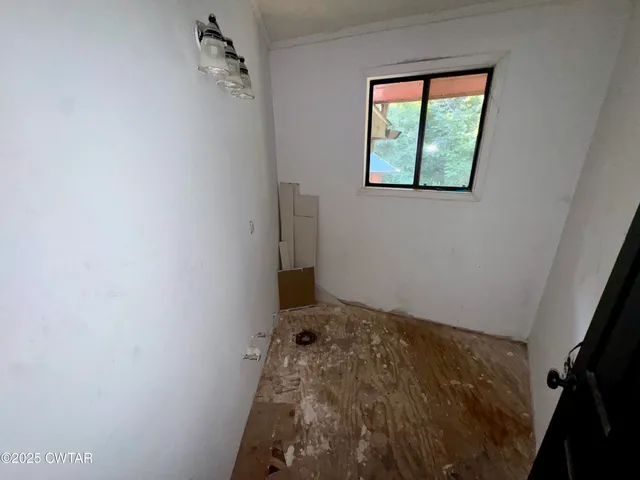 a view of a bathroom from a hallway