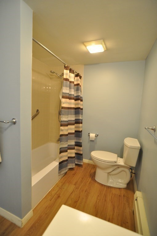 90 Beacon Street, Unit 8 Lawrence, MA 01843 - Photo 12 of 26 a bathroom with a toilet and a shower