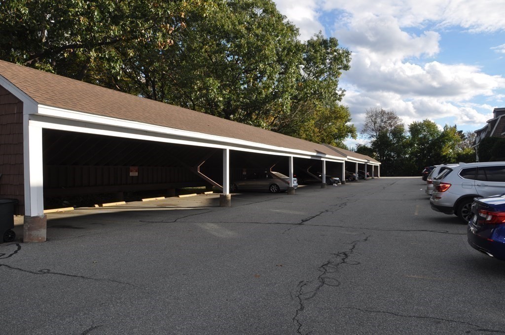 90 Beacon Street, Unit 8 Lawrence, MA 01843 - Photo 15 of 26 a view of a car park in front of house