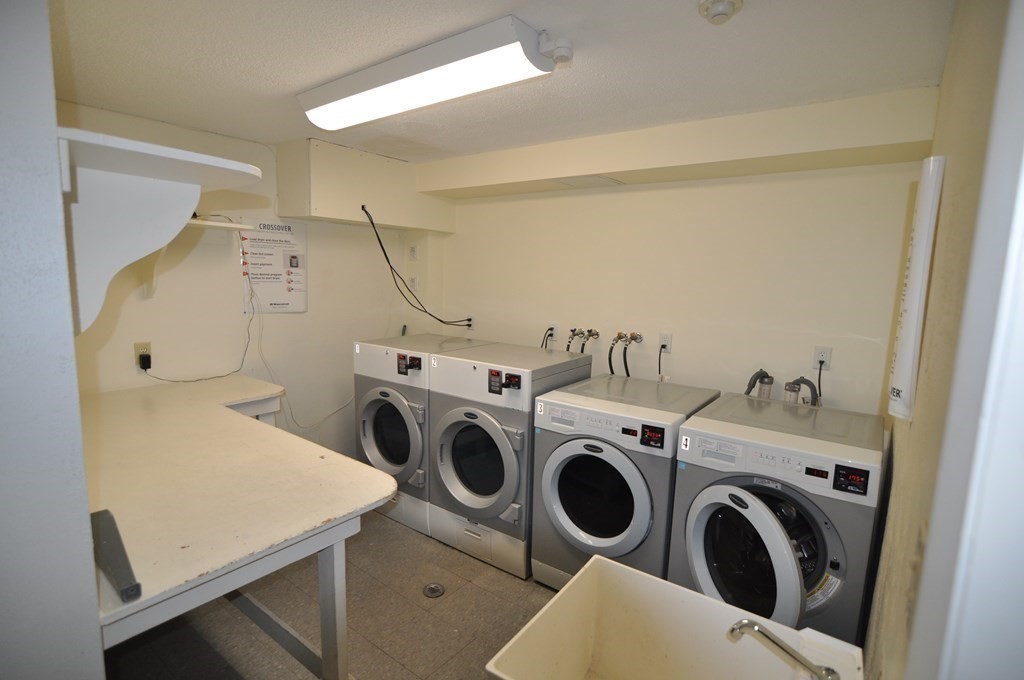 90 Beacon Street, Unit 8 Lawrence, MA 01843 - Photo 21 of 26 a utility room with dryer and washer