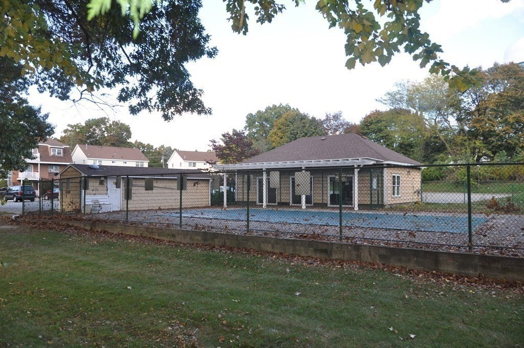 90 Beacon Street, Unit 8 Lawrence, MA 01843 - Photo 22 of 26 a front view of a house with a garden