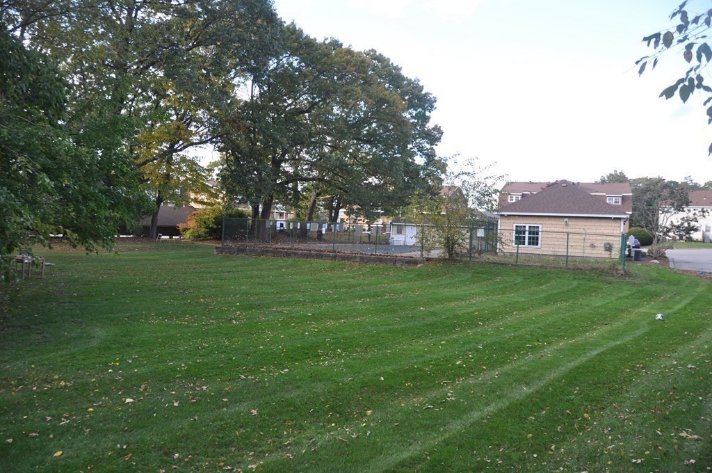 90 Beacon Street, Unit 8 Lawrence, MA 01843 - Photo 23 of 26 a view of a house with a big yard