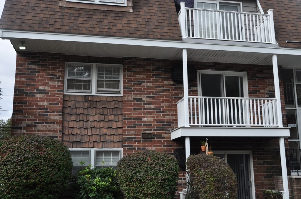 90 Beacon Street, Unit 8 Lawrence, MA 01843 - Photo 4 of 26 a view of a brick house with a window
