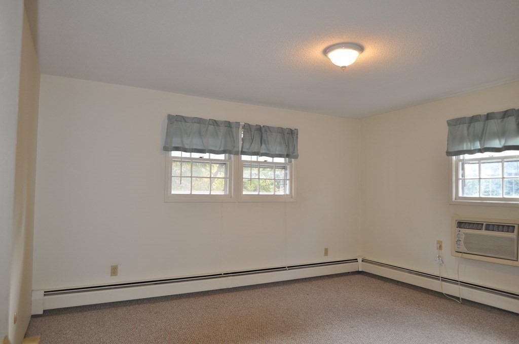 90 Beacon Street, Unit 8 Lawrence, MA 01843 - Photo 9 of 26 an empty room with a empty space and window
