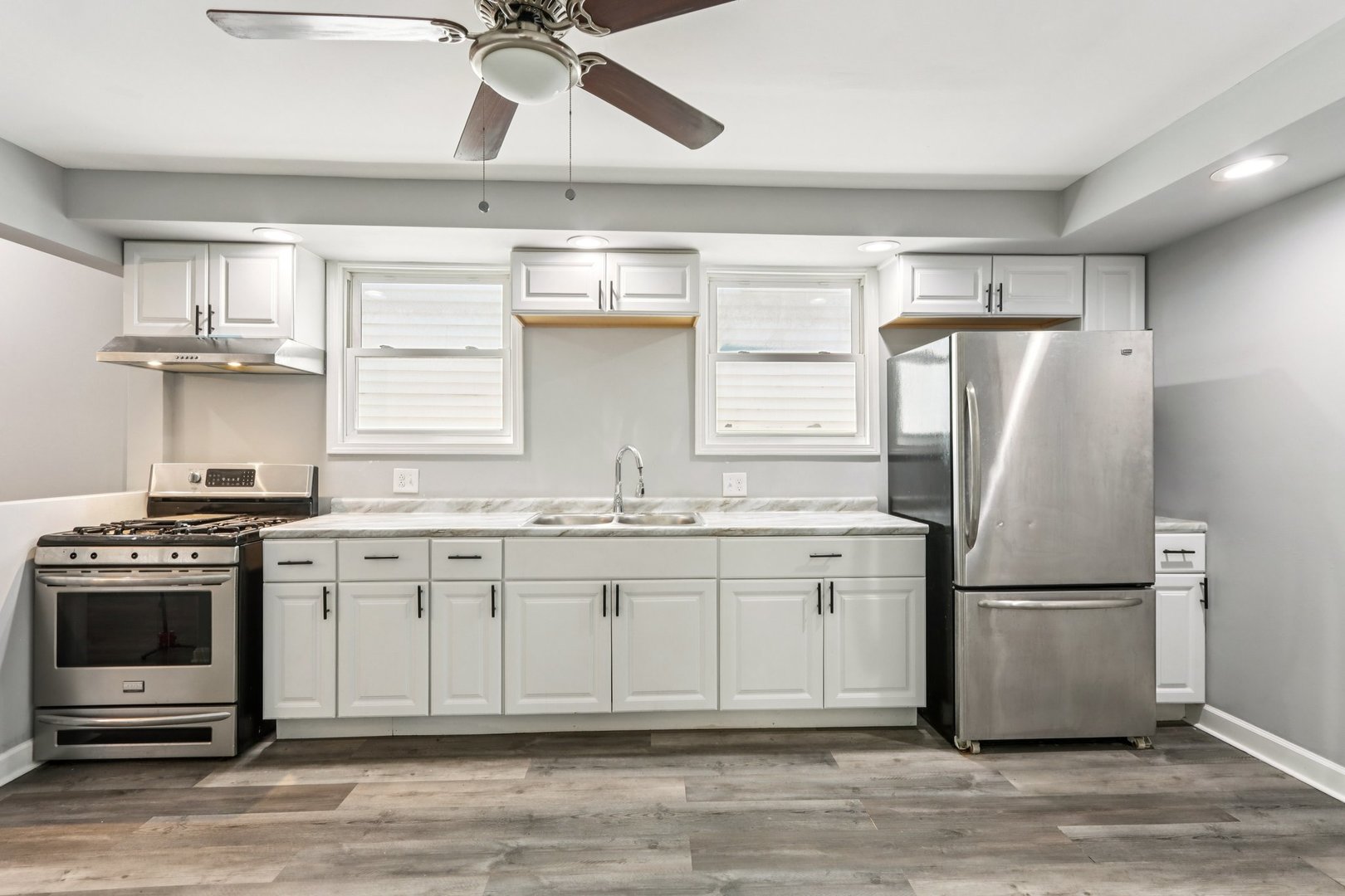 9720 South Exchange Avenue Chicago, IL 60617 - Photo 4 of 17 a kitchen with stainless steel appliances granite countertop a refrigerator a stove a sink and a refrigerator