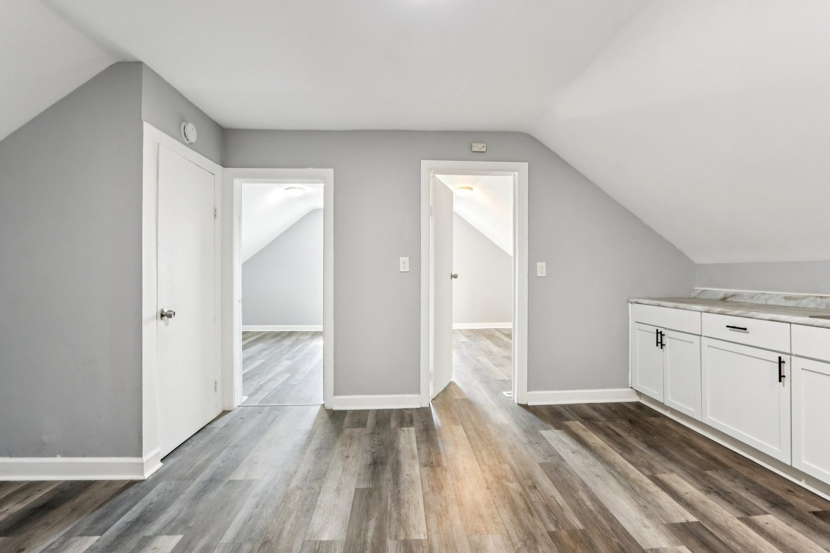 9720 South Exchange Avenue Chicago, IL 60617 - Photo 7 of 17 a view of a kitchen with wooden floor