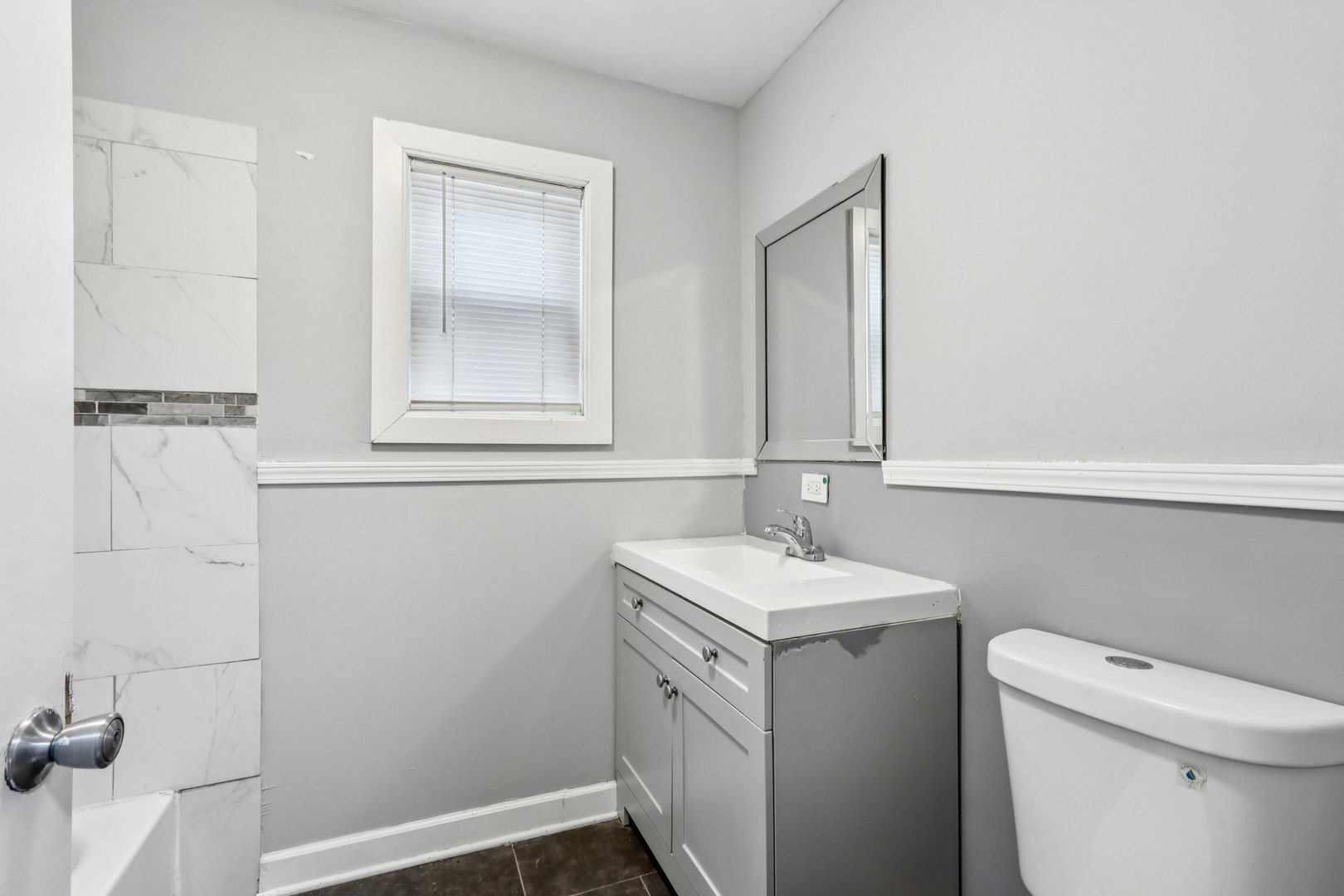 9720 South Exchange Avenue Chicago, IL 60617 - Photo 8 of 17 a bathroom with a sink and a toilet