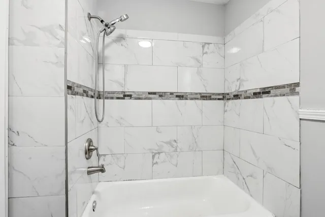 a bathroom with a shower and a shower