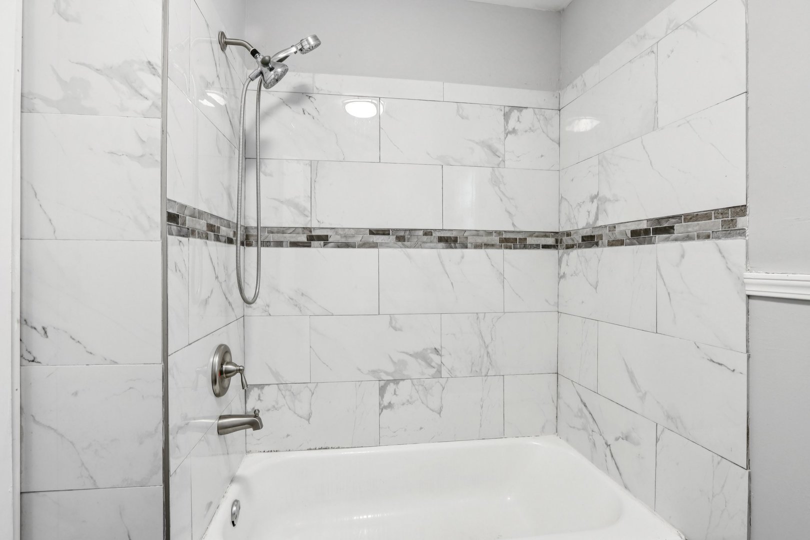 9720 South Exchange Avenue Chicago, IL 60617 - Photo 9 of 17 a bathroom with a shower and a shower