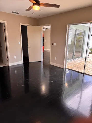 a view of livingroom with hardwood floor and hallway