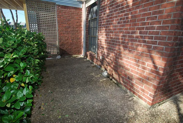 a brick building with a yard