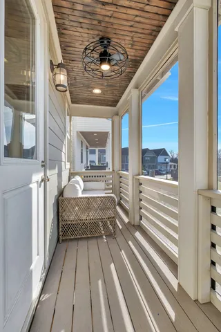 a view of a balcony with outdoor seating