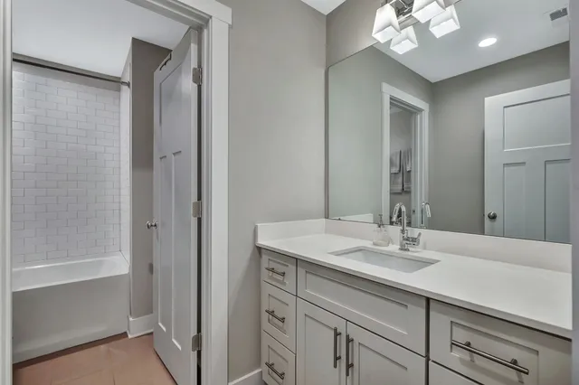 a bathroom with a sink double vanity and a mirror