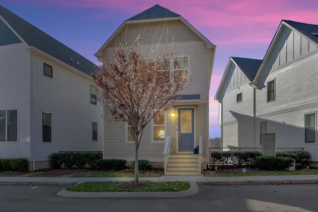 a front view of a house with garden