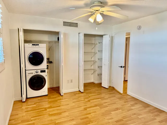a view of a bedroom with closet and cabinet