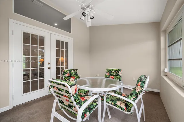 a dining room with furniture and window
