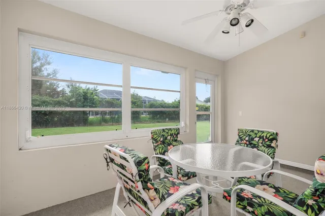 a view of a dining room with furniture window and outside view