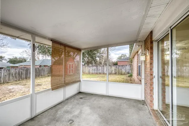 a view of an empty room and window
