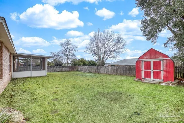 a view of a backyard of the house