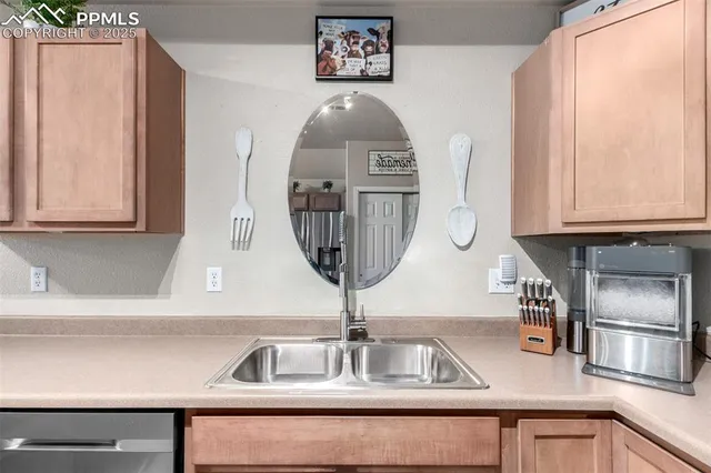 a kitchen with a sink and a refrigerator