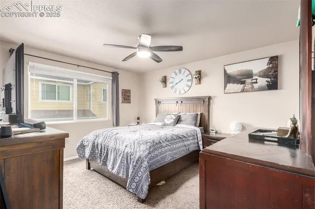 a bedroom with a bed and a table