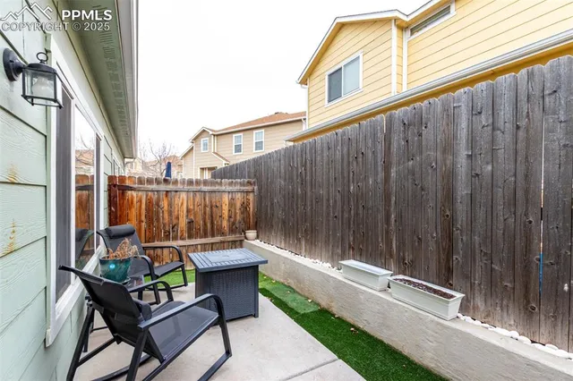 a view of a chair and table in the balcony